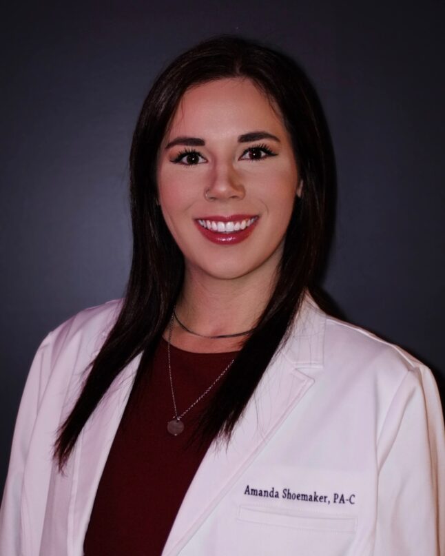 Headshot of Amanda Shoemaker in a white medical jacket